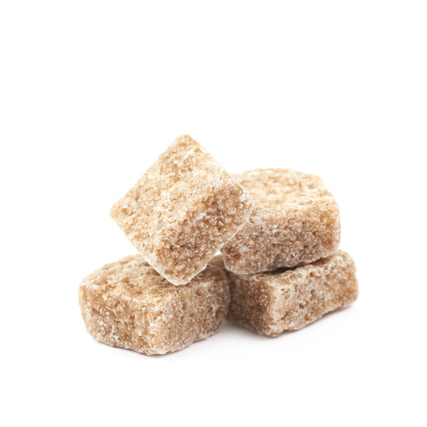 Pile of brown sugar cubes isolated - Foto, Imagen