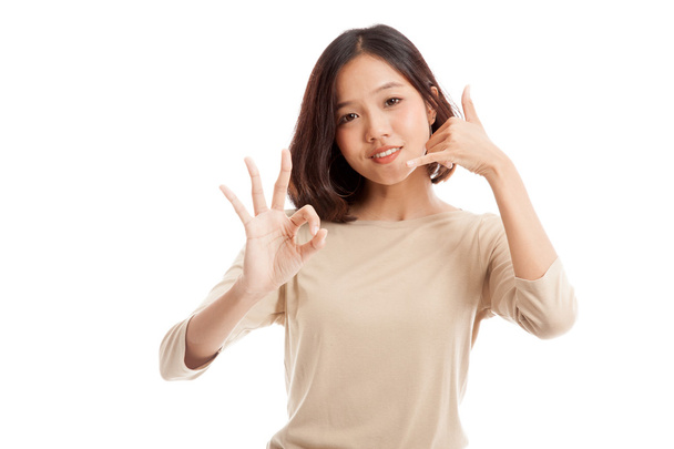 Young Asian woman show with phone gesture and OK sign - Fotoğraf, Görsel