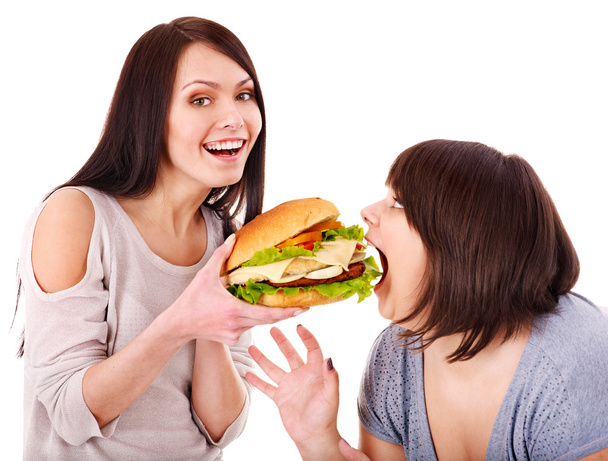 Mujeres comiendo hamburguesa
. - Foto, imagen