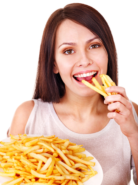 Женщина ест картошку фри
. - Фото, изображение
