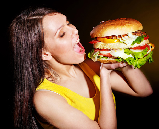 Woman bite hamburger. - Photo, Image