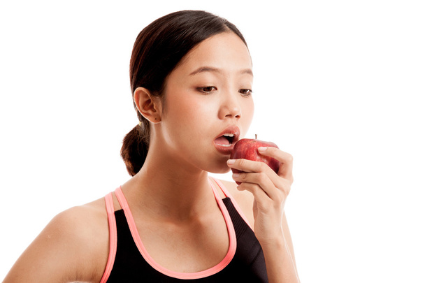 Beautiful Asian healthy girl eat red apple - Foto, Bild