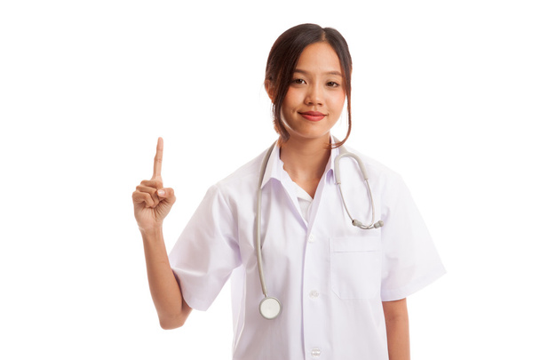 Asian young female doctor point up - Foto, imagen