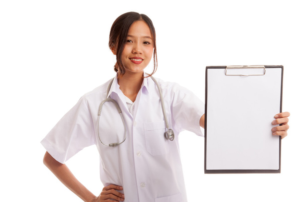 Young Asian female doctor show a blank clipboard - Fotoğraf, Görsel