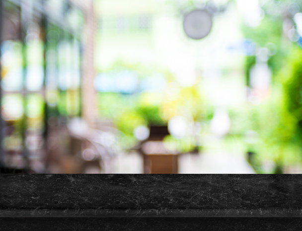 Empty luxury black marble table top with blurred cafe bokeh ligh - Photo, Image
