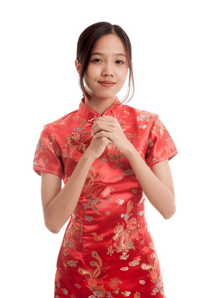 Asian girl in chinese cheongsam dress with gesture of congratula - Foto, imagen