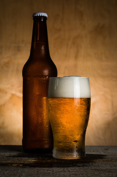Beer in bottle and glass with ice drops - Foto, immagini