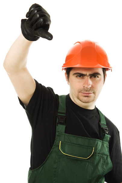 Businessman in helmet pointing down. - Photo, image