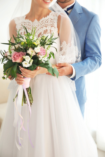 Groom and bride with beautiful bouquet - Foto, immagini