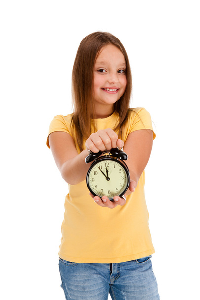 Girl holding alarm-clock isolated on white background - Photo, Image