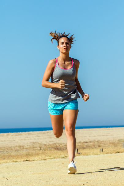 Young woman running to camera. - Φωτογραφία, εικόνα