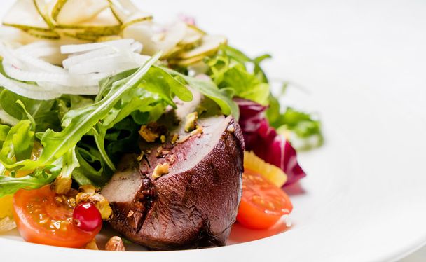 salad with meat on white plate - 写真・画像