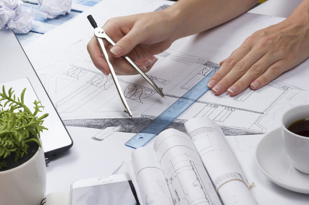 Architect working on blueprint. Architects workplace - architectural project, blueprints, ruler, calculator, laptop and divider compass. Construction concept. Engineering tools. Top view. - Photo, Image