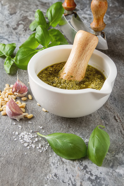 Homemade green pesto sauce with basil and pine nuts in white mor - Fotografie, Obrázek