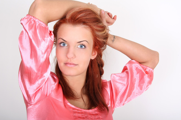 Red-haired woman with tatoo - Foto, imagen