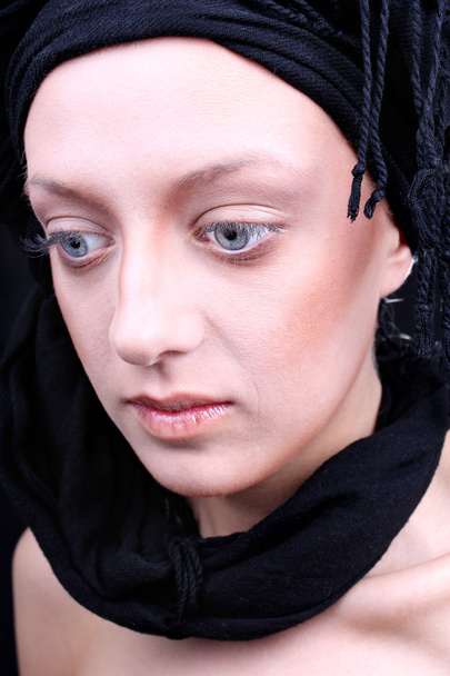 Beautiful young woman with black scarf - Фото, зображення