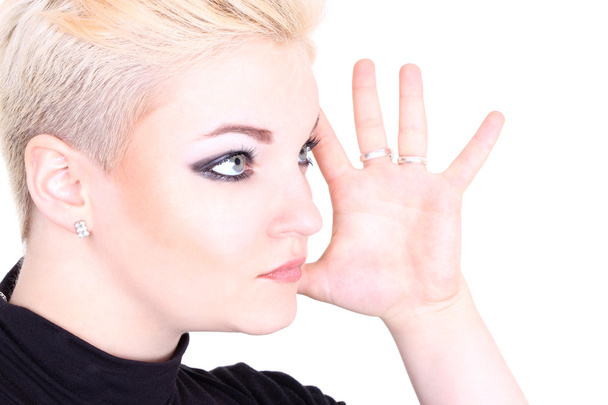 Blonde woman in black showing hand - Foto, Bild