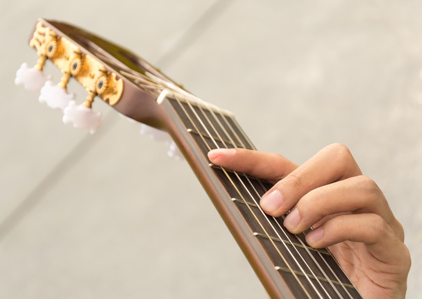  hand playing on  guitar - Zdjęcie, obraz