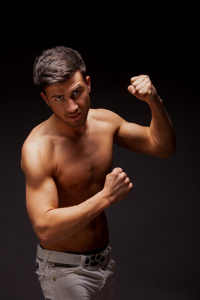 Young handsome muscular man - Фото, изображение