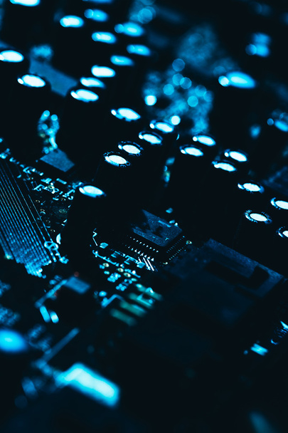 computer motherboard in blue dark background close-up - Foto, Bild