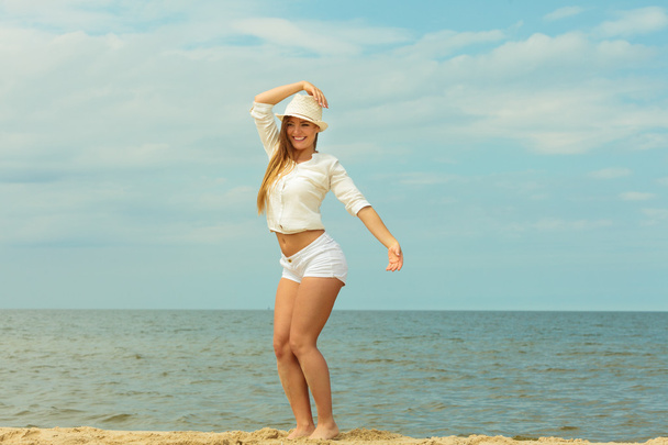 Young joyful girl on beach. - Фото, зображення