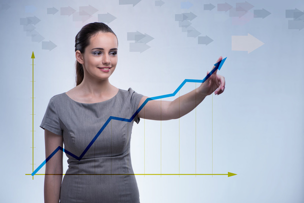 Young businesswoman with chart diagrams - Photo, Image