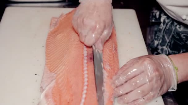Close up shot the cook cut fresh red fish - 映像、動画