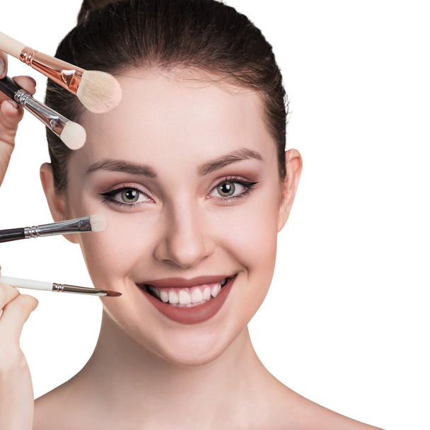 Young woman with makeup brushes - Photo, Image