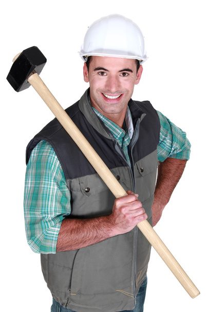 Cheerful worker with a sledgehammer - Foto, afbeelding