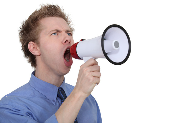 Man yelling into a megaphone - Zdjęcie, obraz
