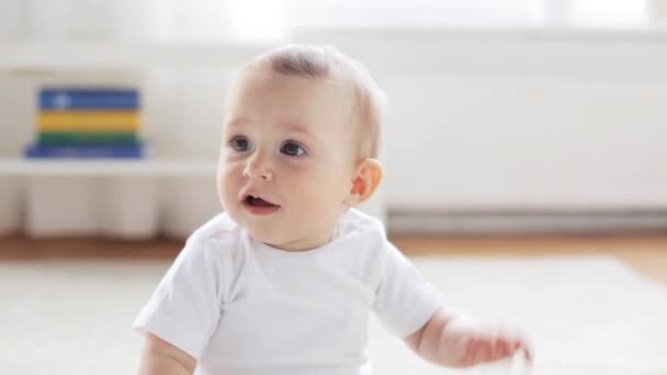 happy little baby sitting in living room at home 12 - Footage, Video