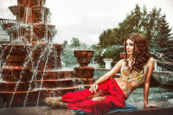 girl lying on the fountain - Photo, Image