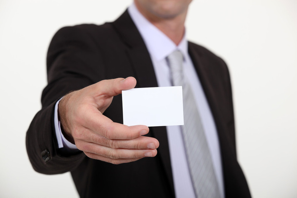 Man holding a blank business card - Fotó, kép