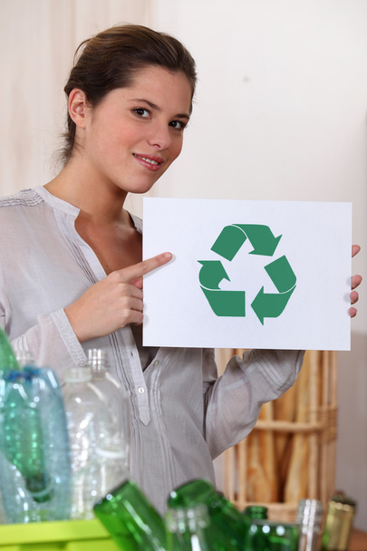 Woman recycling glass and plastic bottles - Fotoğraf, Görsel