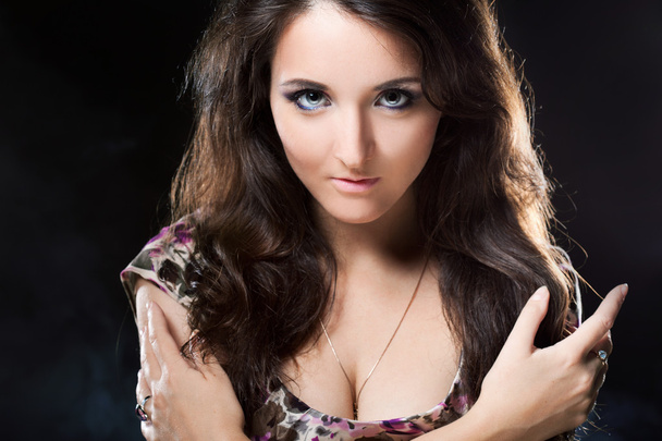 Beautiful attractive woman posing in Studio on black background - Foto, afbeelding