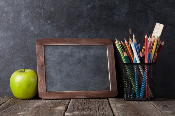 Supplies, apple and chalk board - Photo, Image