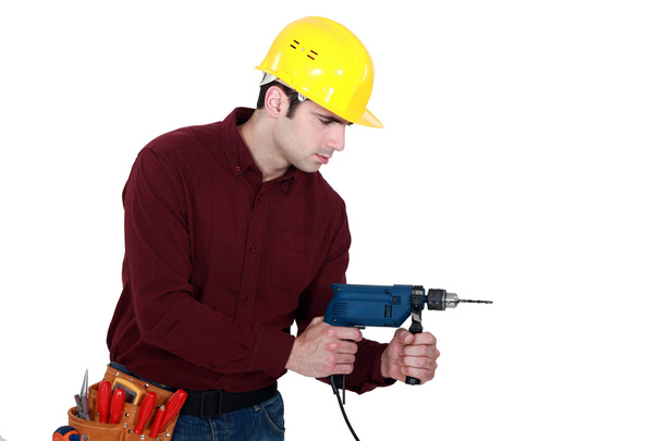 Workman with a drill - Foto, Bild