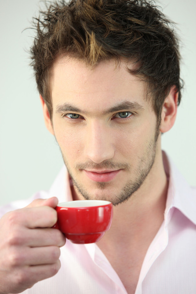 Man holding small cup of coffee - Фото, зображення