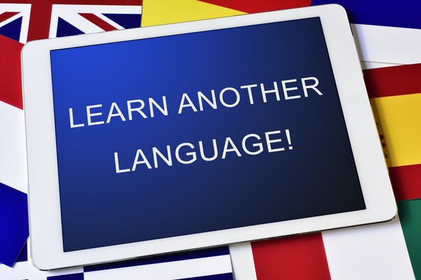 κειμένου να μάθουν μια άλλη γλώσσα σε έναν υπολογιστή tablet - Φωτογραφία, εικόνα