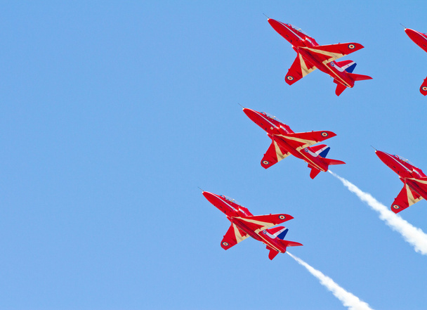 Red Arrows Aerobatic Display Team against blue sky - Foto, Imagem