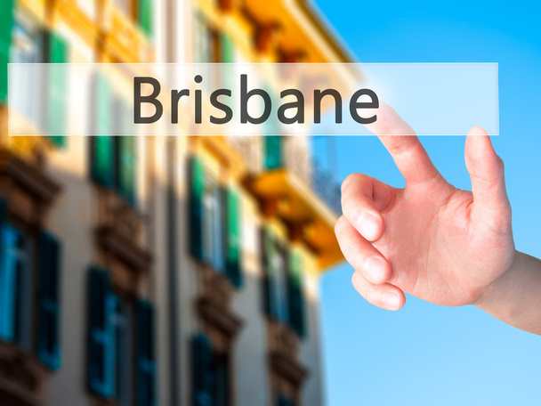 Brisbane - Hand indrukken van een knop op onscherpe achtergrond concept  - Foto, afbeelding