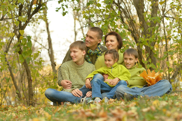 Happy family in autumn forest - Fotó, kép