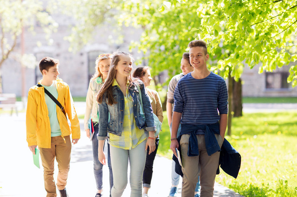 group of happy teenage students walking outdoors - Foto, imagen