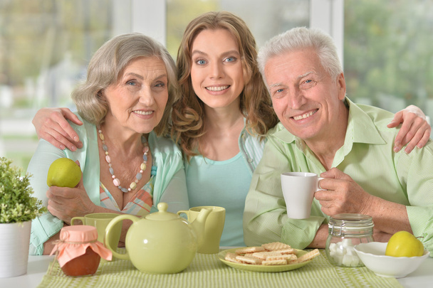 daughter with senior parents drinking tea  - Photo, Image