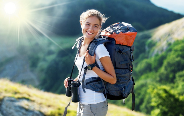 Woman with backpack trekking  - 写真・画像
