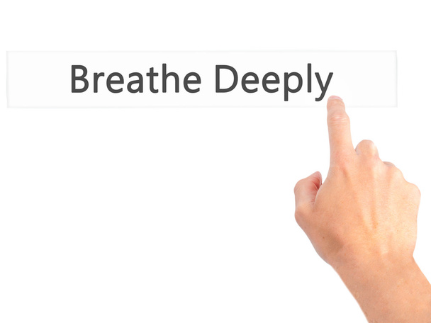 Breathe Deeply - Hand pressing a button on blurred background co - Photo, Image