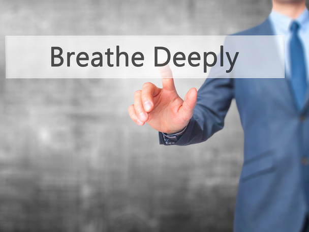 Дышите глубоко - Businessman hand touch button on virtual scre
 - Фото, изображение