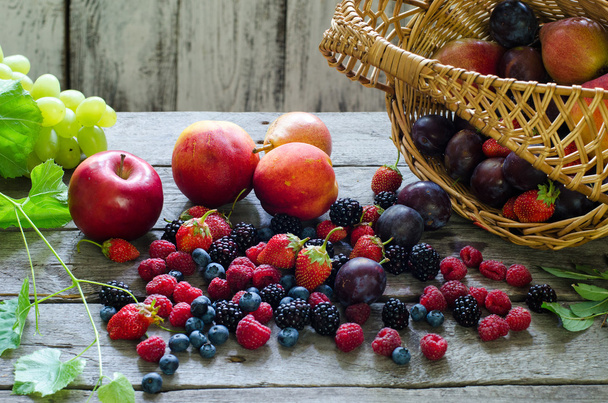 Berries, summer fruit on wooden table. healthy lifestyle concept. - 写真・画像