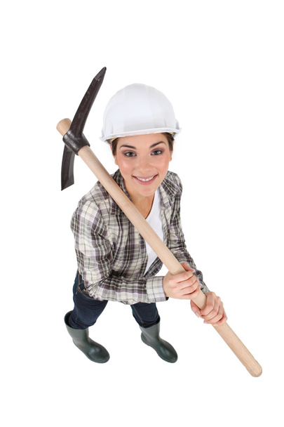 Craftswoman holding a pickaxe - Photo, image