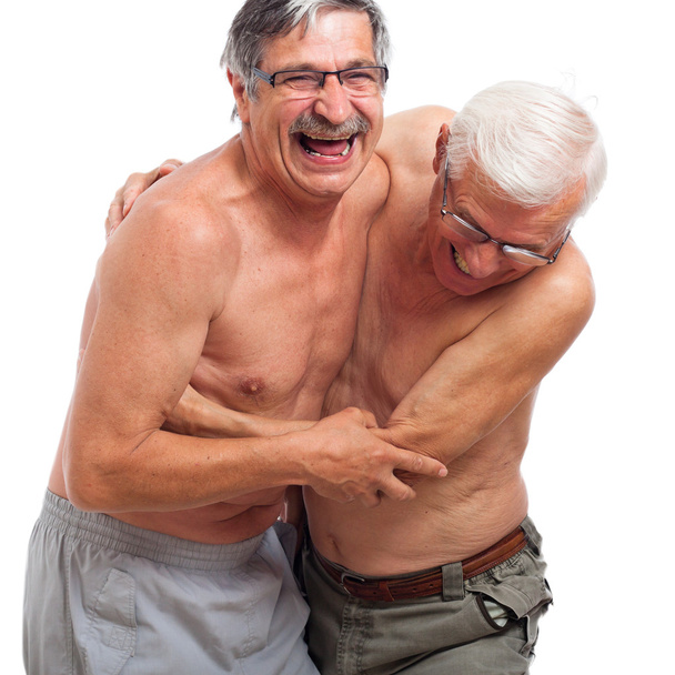 Laughing seniors fighting for fun - Photo, Image